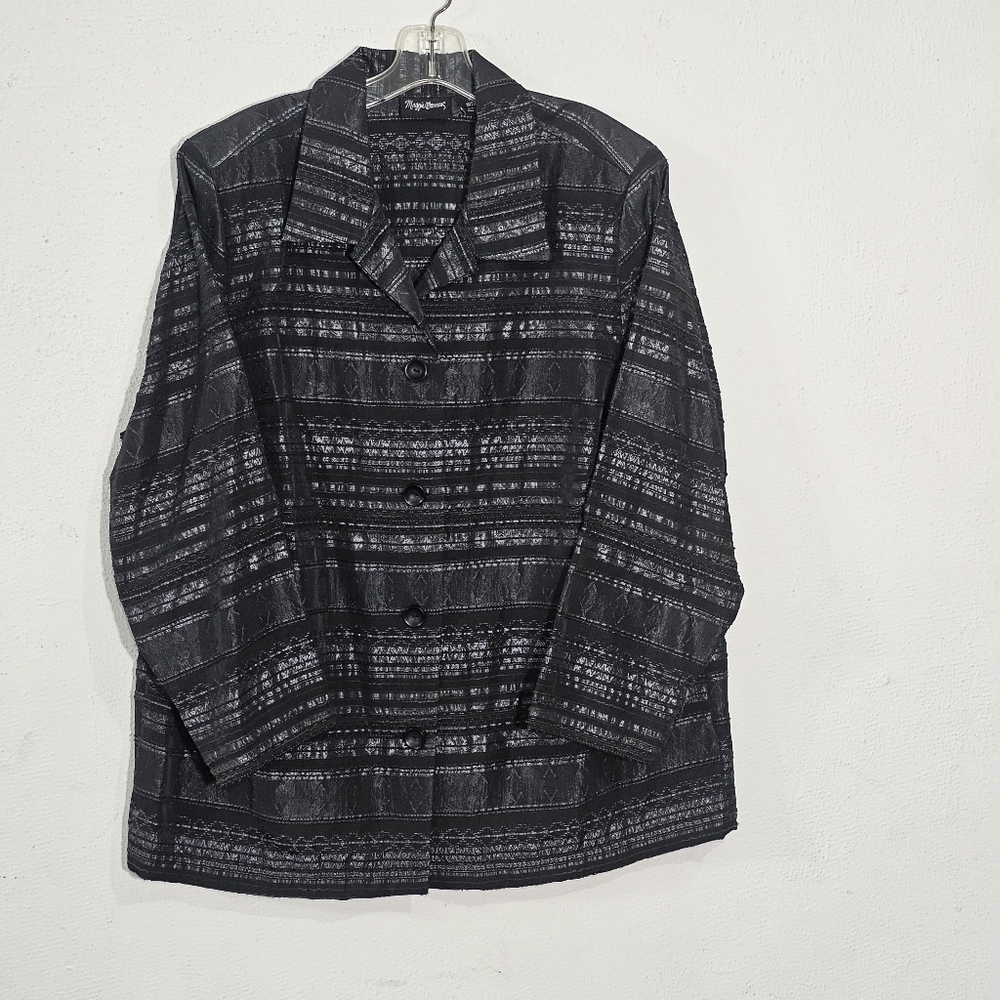 Maggy London The cut of the jacket, with buttons on the right (common in women's